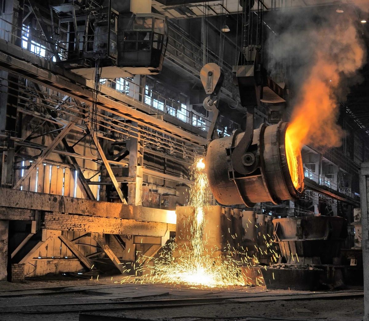 Molten steel pouring from industrial ladle